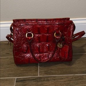 Red Brahmin crocodile leather purse.